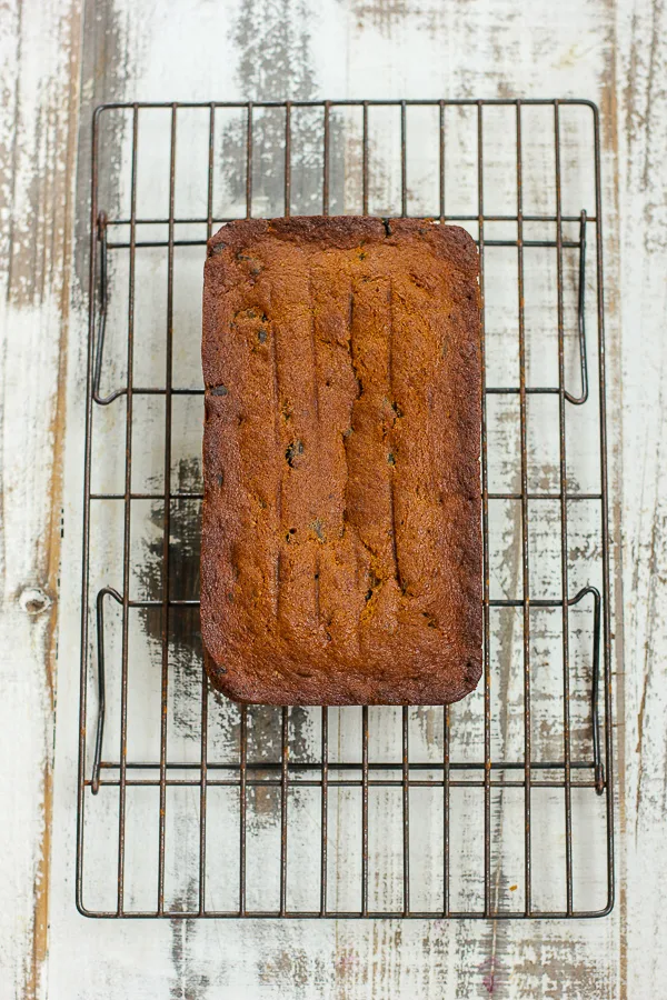 finished loaf of banana bread cooling on a wire rack