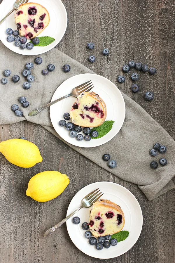 Flatly photo showing three slice of cake on individual plates