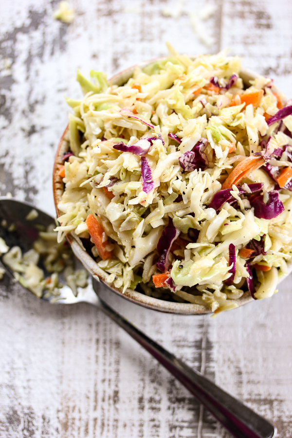 This mayo free coleslaw takes just minutes to prepare and is full of tangy, delicious flavor. It's a perfect addition to any backyard BBQ or picnic.