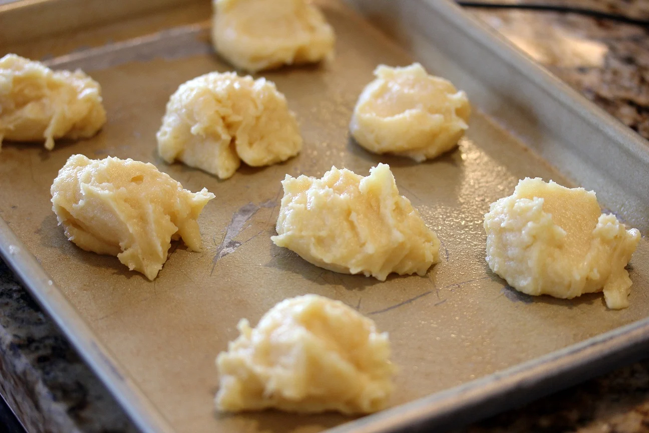 cream puff dough on the baking sheet before baking