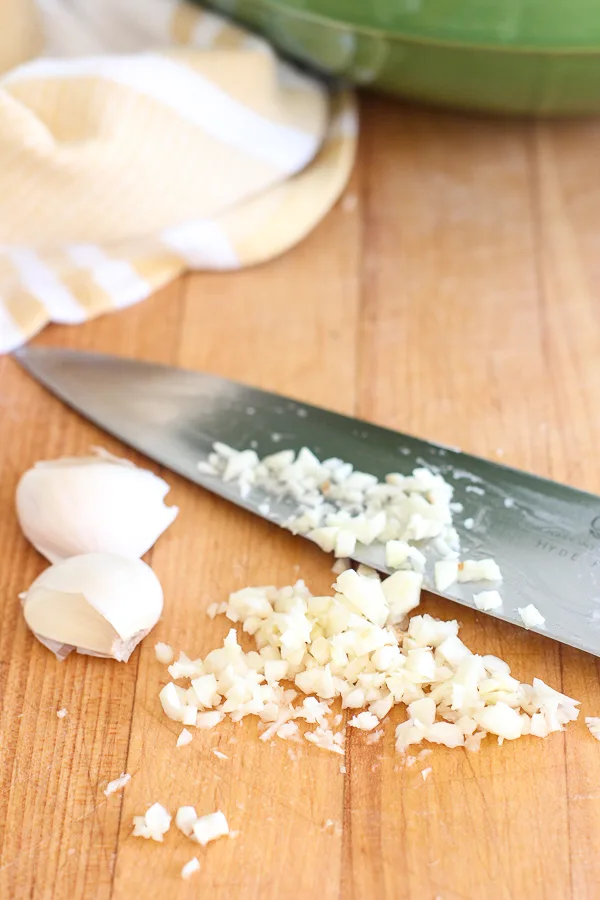 Demonstrating the garlic being chopped