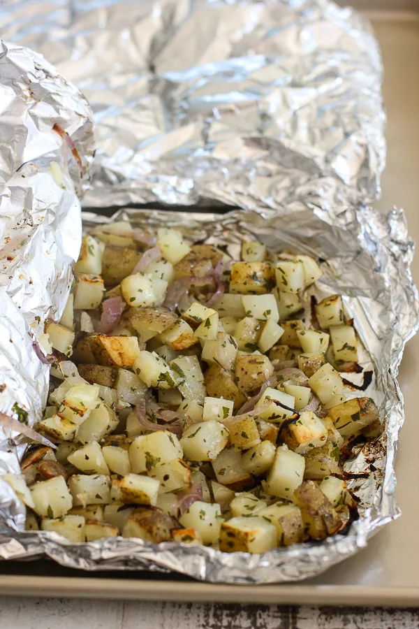 The grill potatoes in the aluminum foil after grilling