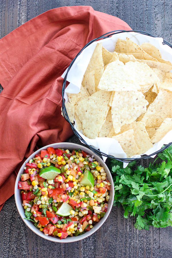 Finished grilled corn and jalapeno salsa shown being served with tortilla chips