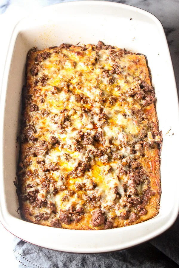 Easy Deep Dish Pizza Casserole in the casserole dish after baking and before cutting and serving.