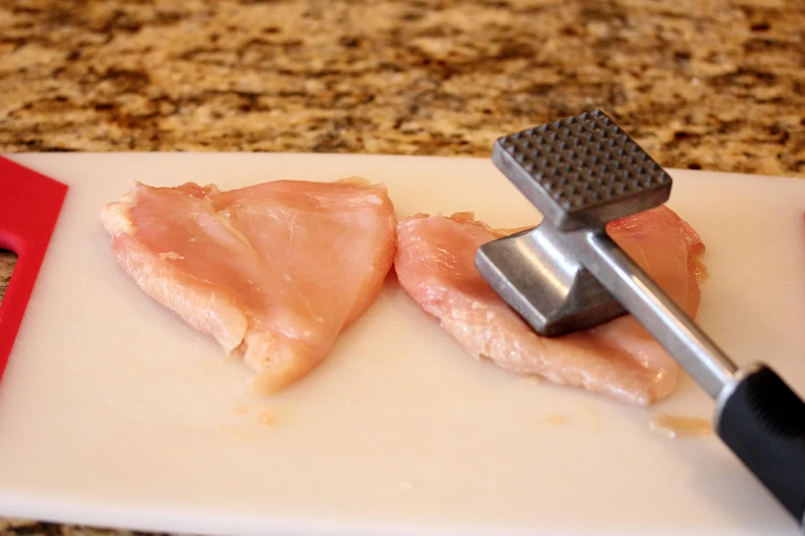 pounding out the chicken breasts