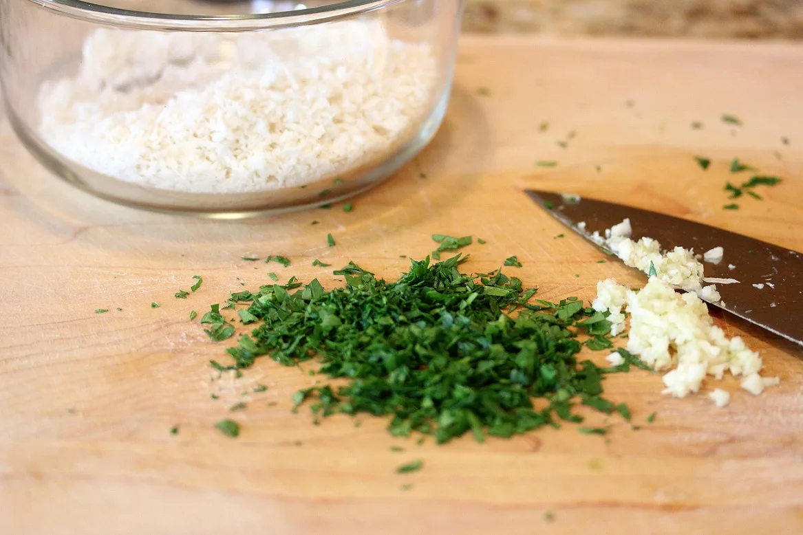 chopping the parsley and garlic for the panko breadcrumbs