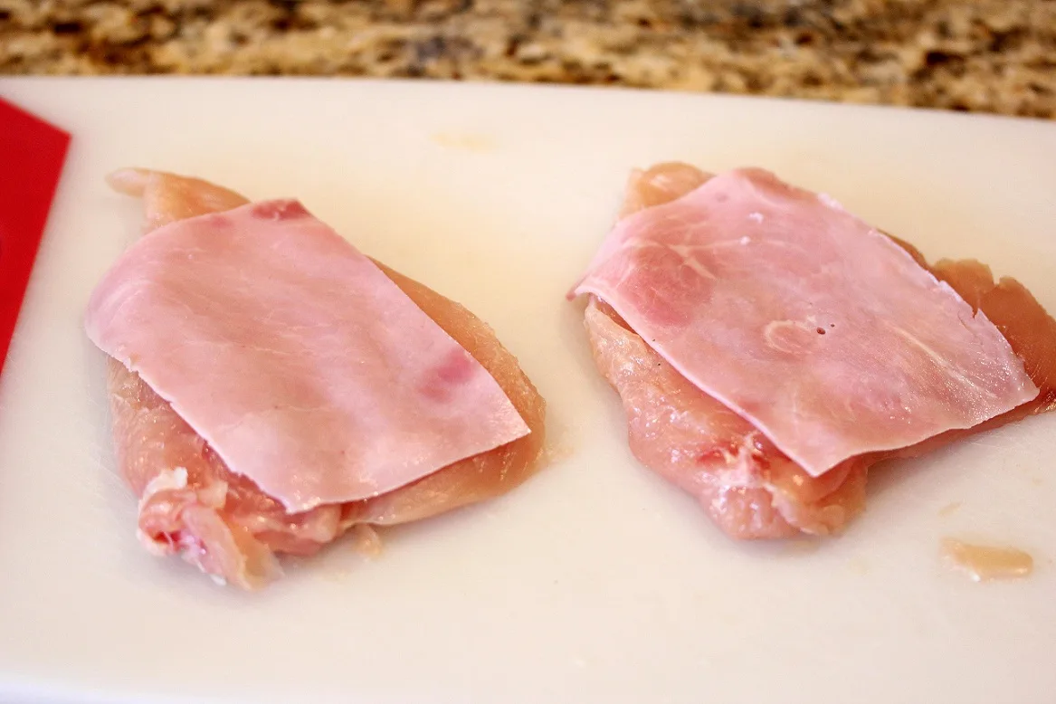 pounded out chicken breasts topped with ham slices