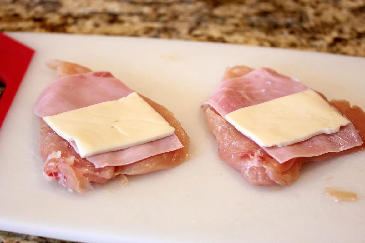 chicken breasts topped with ham and cheese slices