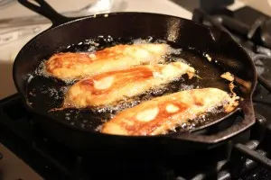 Fish fillets frying on the second side