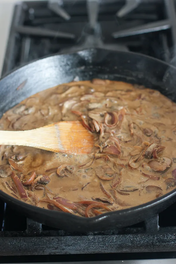 The finished stroganoff sauce simmering in the cast iron skillet