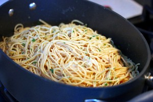 Pasta aglio olio in the skillet before serving