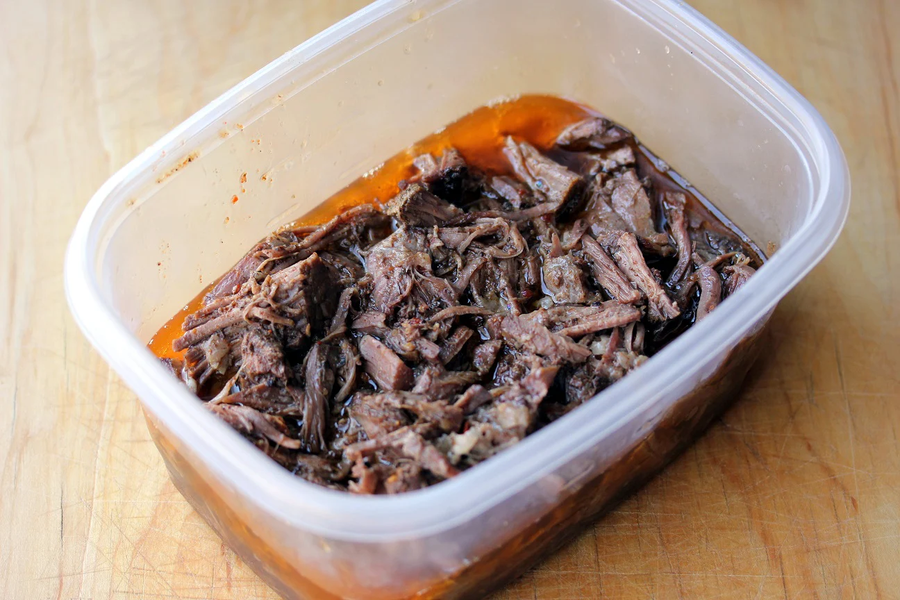 Shredded Mexican beef in a storage container