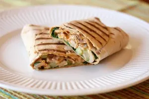 Grilled buffalo chicken wrap cut in half and plated