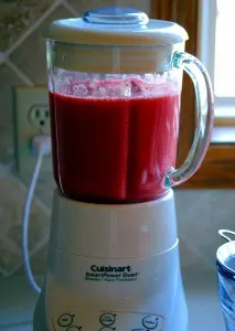strawberries in the blender after being pureed.