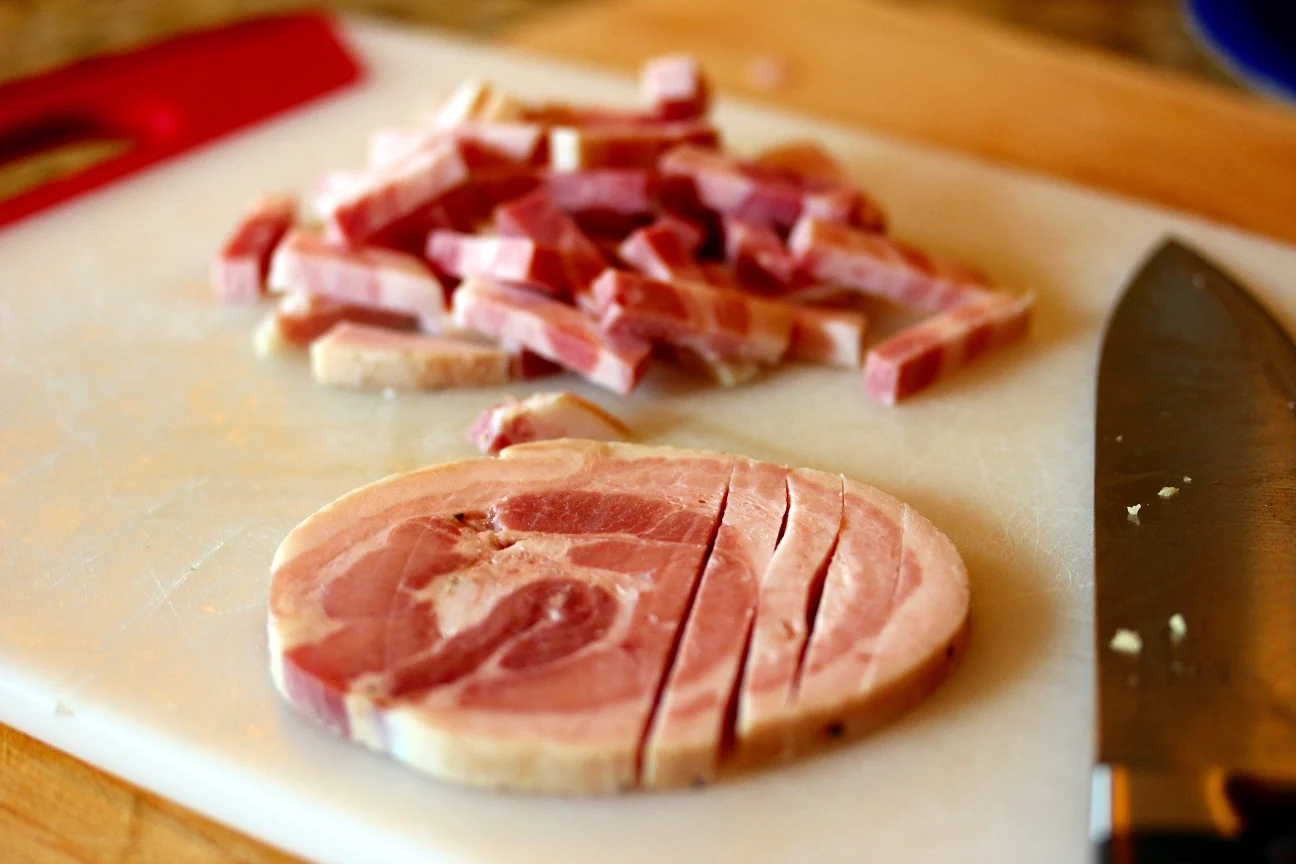 Pancetta being sliced to put into the bucatini all' amatriciana