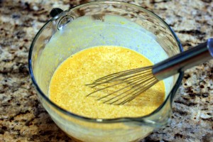 The pumpkin egg mixture being whisked together in a mixing bowl.