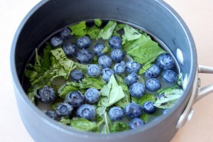 Blueberries and mint in a pot with the simple syrup