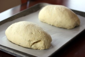 Dough divided into two oval shaped loaves  