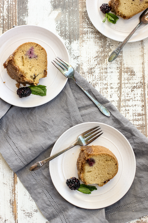 Overhead photo of sliced and plated blackberry coffee cake