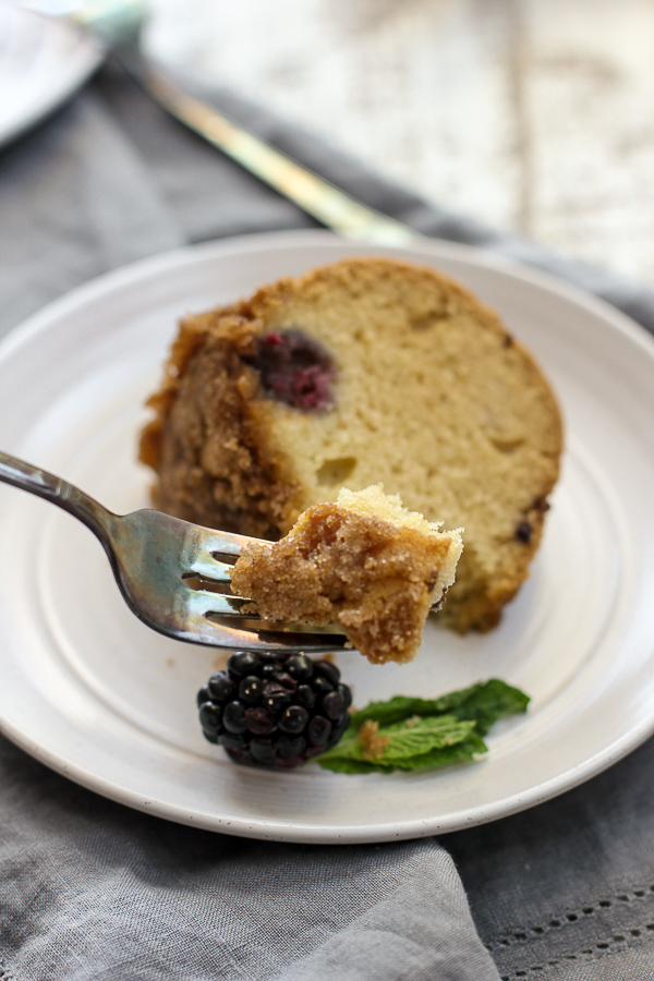 Showing a bite of the dairy free blackberry coffee cake