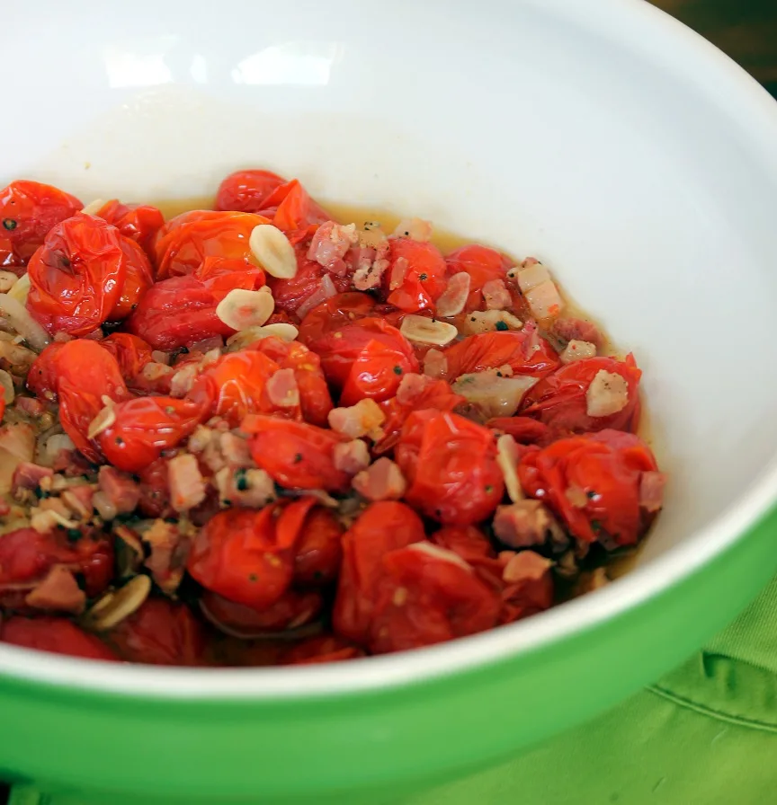 roasted tomato mixture in a bowl before being mashed