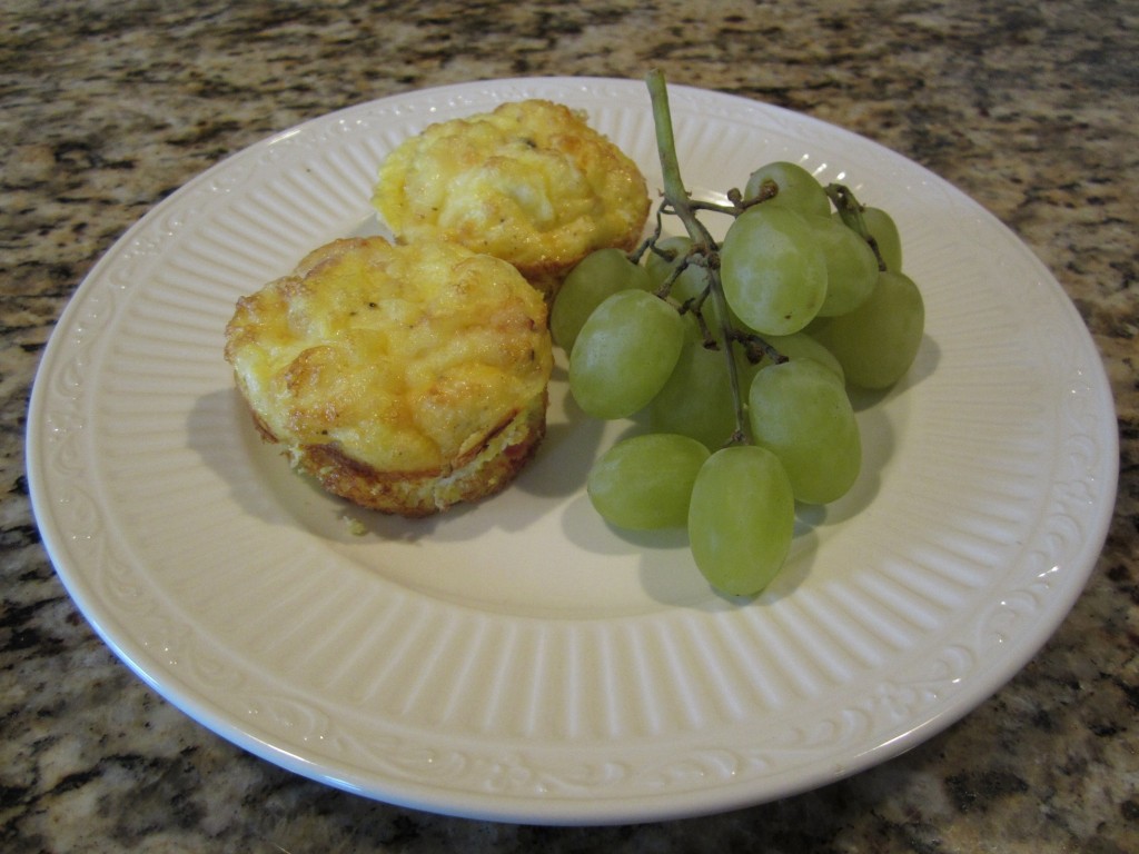 Ham and cheese frittatas plated with grapes