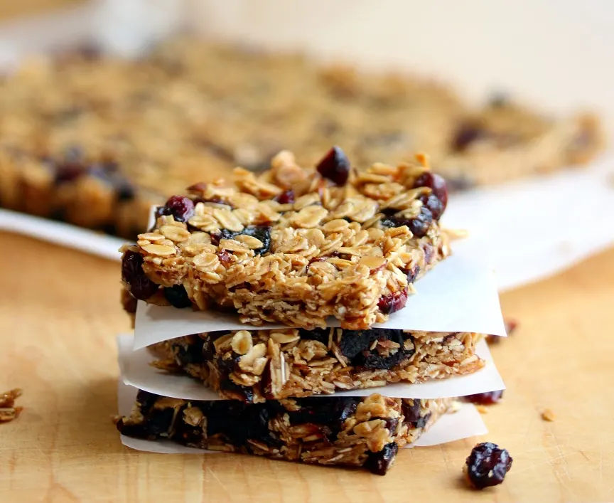 3 Mixed berry granola bars stacked on top of each other 