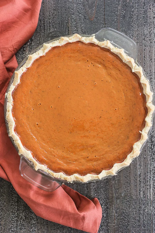 Overhead shot of maple pumpkin pie after it's done baking