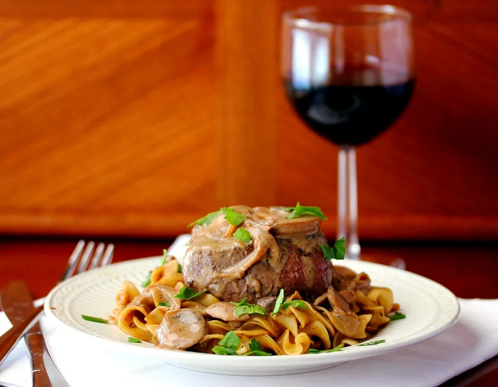 filet mignon served over egg noodles and topped with mushroom sauce