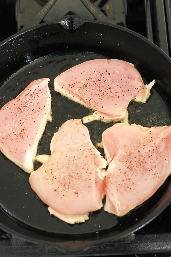 Searing the chicken breast in a cast iron skillet