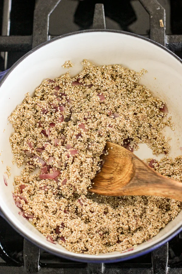 Sautéing quinoa with the onions and garlic