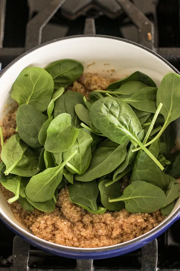 Spinach added to the pan before wilting