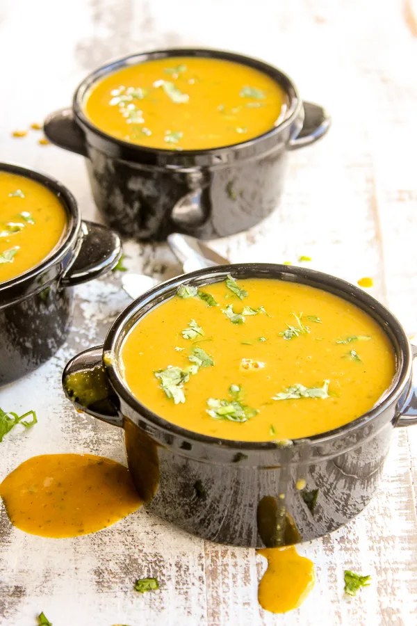 Curried pumpkin soup is rich, creamy and full of perfectly spiced flavor.  It's ready in under 30 minutes, making it perfect for quick meals.
