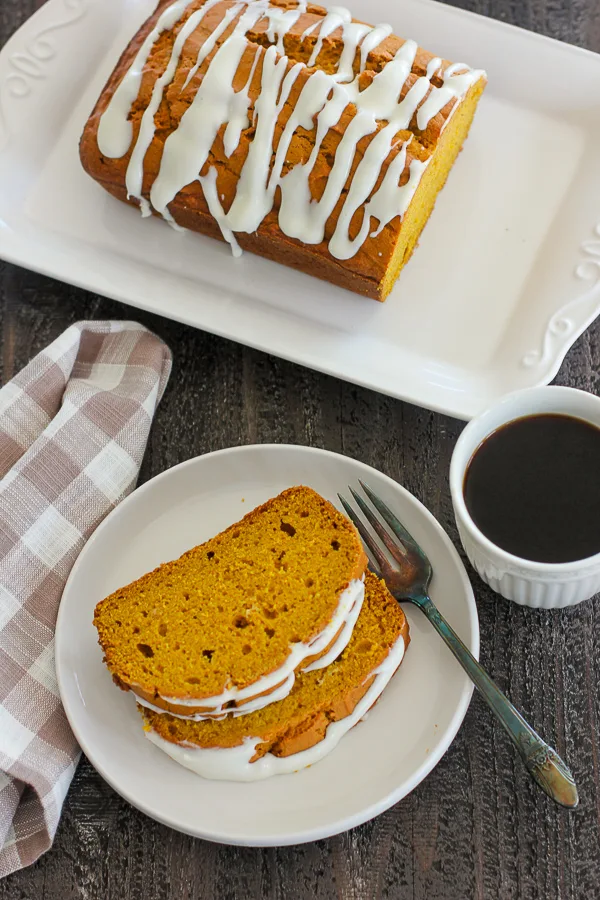 Overhead photo of plated pumpkin bread with cream cheese slices