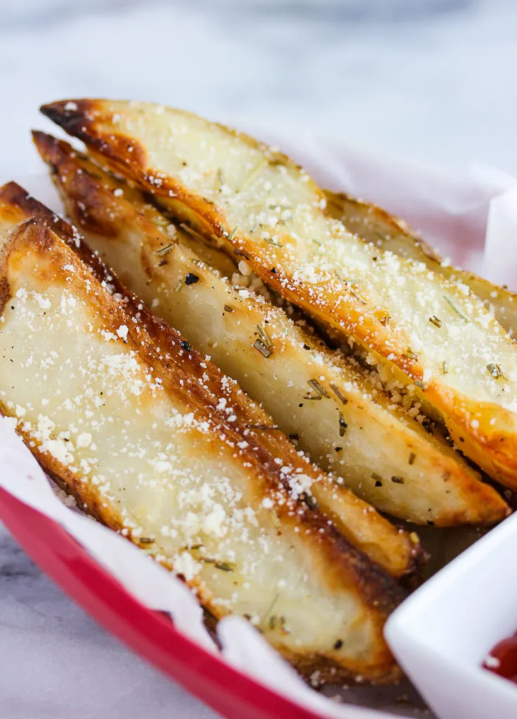 Close up of finished baked rosemary parmesan steak fries