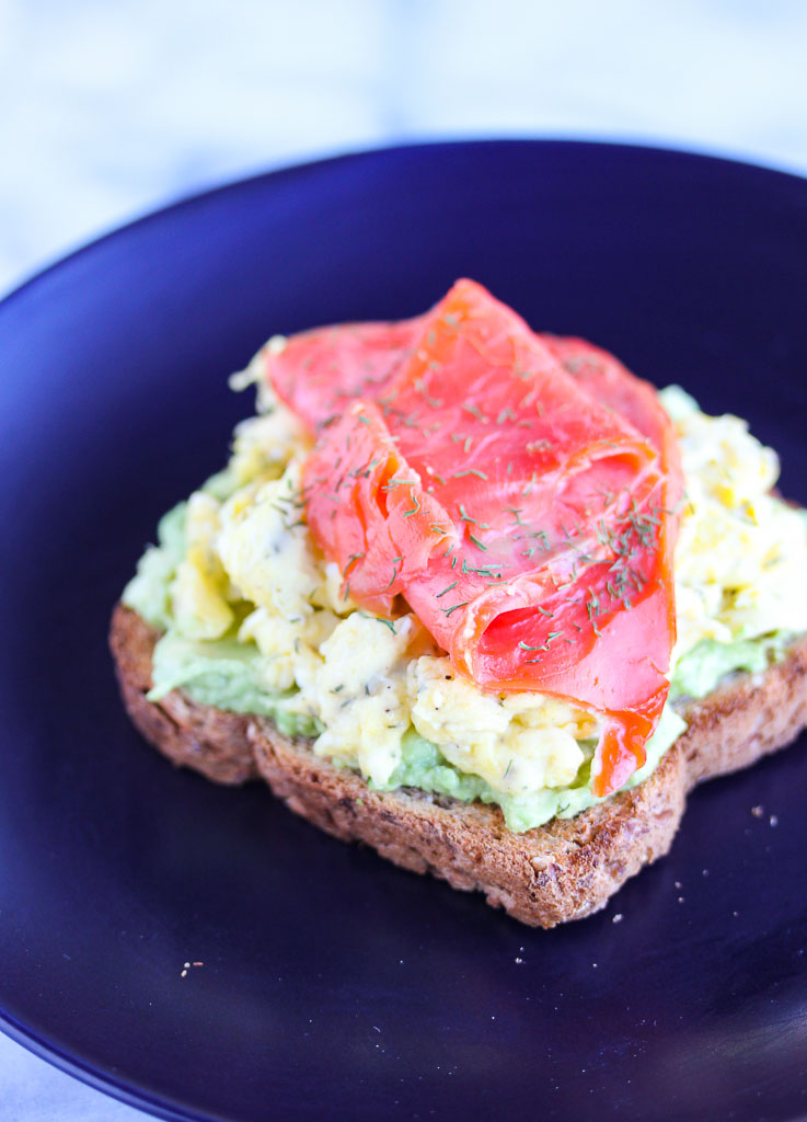 Toast topped with avocado, egg and smoked salmon