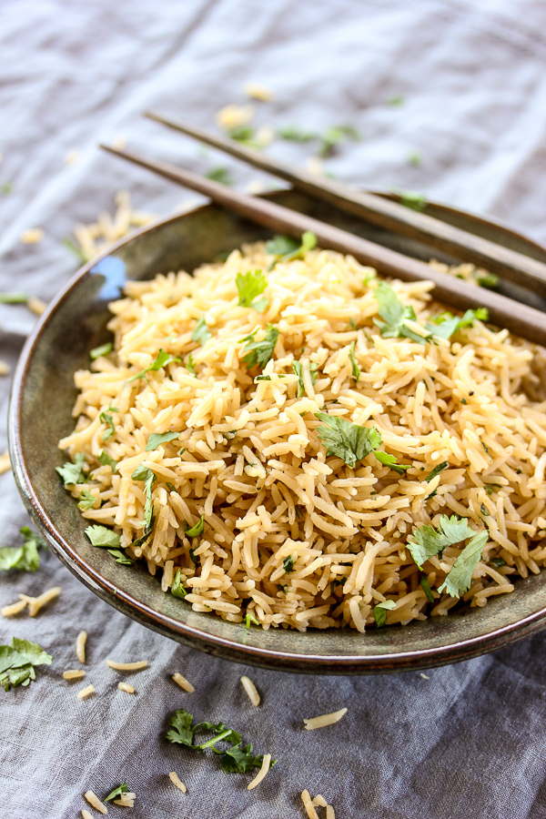 This Asian rice pilaf brings rice to a new level with it's wonderfully savory flavor and tastes amazing paired with grilled meats or fish. | lisasdinnertimedish.com