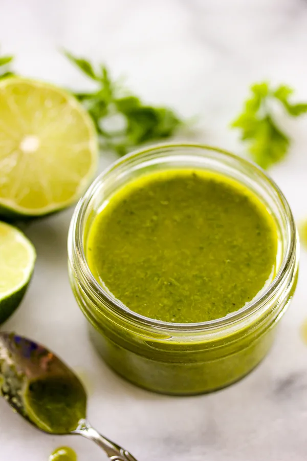The possiblities for this spicy jalapeño lime vinaigrette are endless. It takes literally minutes to make and is great for dressing salads as well as tossing with your favorite cooked vegetables or drizzling over grilled meats. | lisasdinnertimedish.com