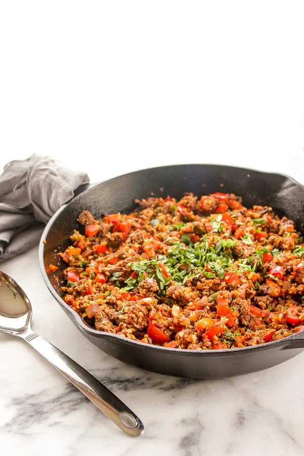 Spanish Cauliflower Rice is a healthy, low-carb version of the traditional dish. It's full of delicious flavor and is quick and easy, making it perfect for weeknight dinners. | lisasdinnertimedish.com