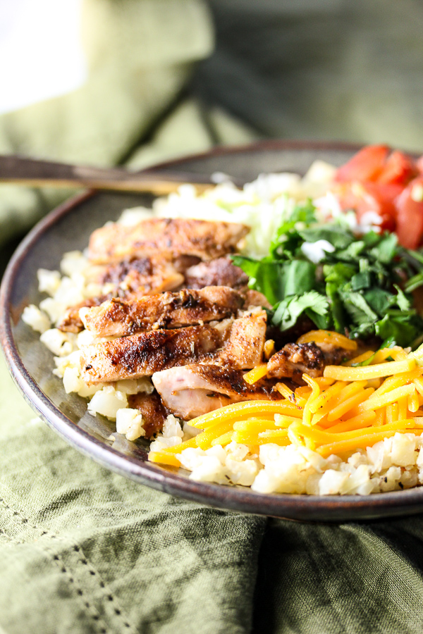 These easy, healthy Jerk Chicken Caribbean Bowls start with a flavorful spice blend and are finished with your favorite fresh toppings. They're family friendly and perfect for busy weeknights.