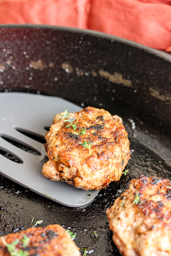 Sausage on a spatula coming out of the pan