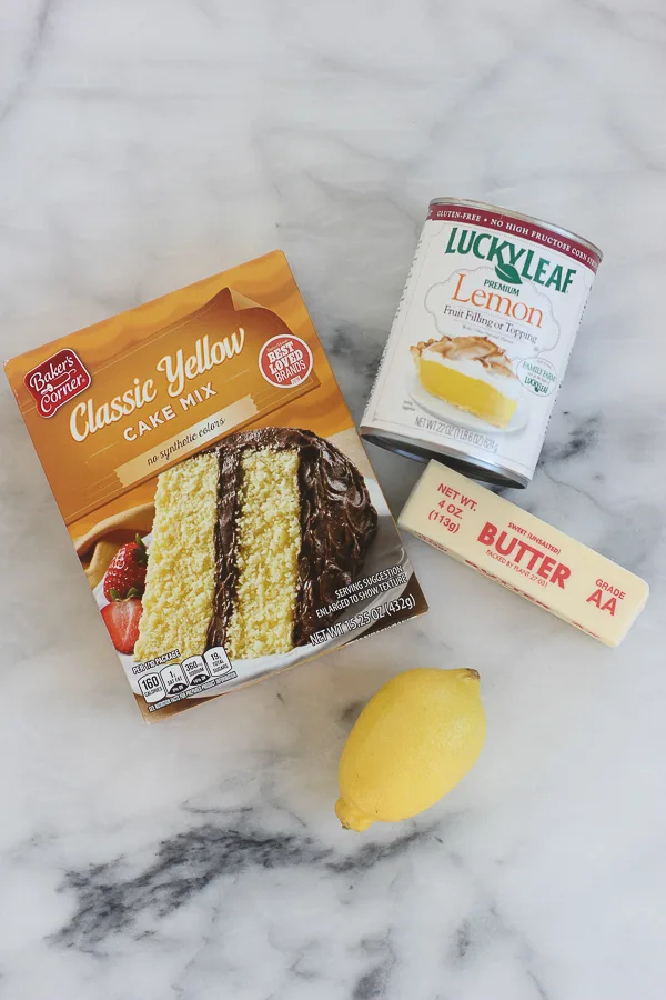 Ingredients needed to make easiest ever lemon bars - cake mix, lemon pie filling butter and lemon