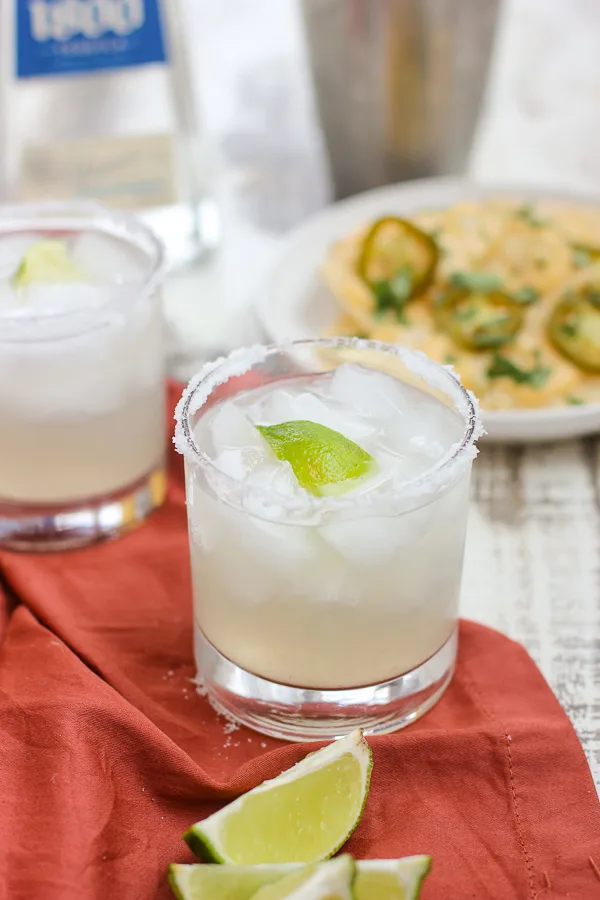 Skinny margarita served with queso nachos
