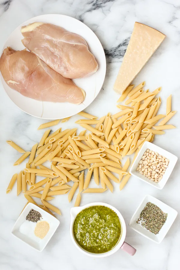 ingredients needed to make grilled chicken pesto pasta displayed