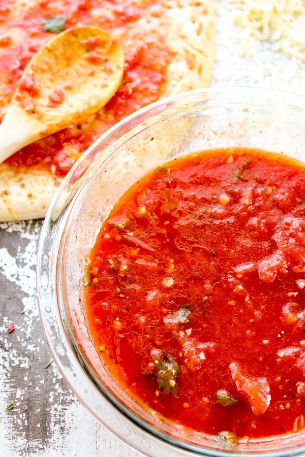 You're going to want this no-cook homemade pizza sauce for your next pizza night. It couldn't be easier to make and tastes so fresh and delicious.