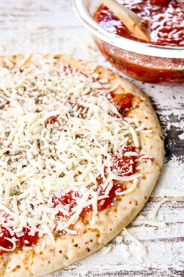 You're going to want this no-cook homemade pizza sauce for your next pizza night. It couldn't be easier to make and tastes so fresh and delicious.