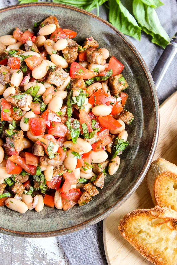 Overhead close up of finished Italian sausage and white bean bruschetta