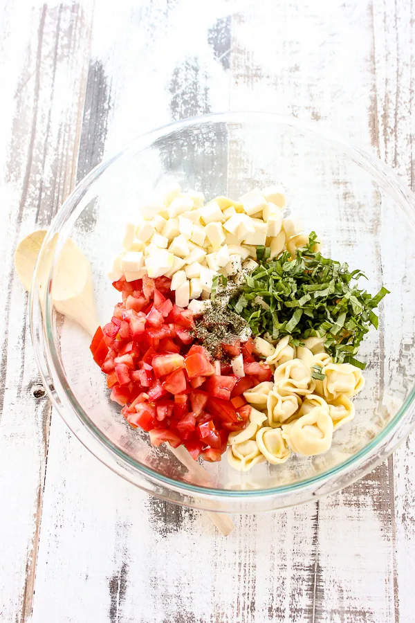 This Tortellini Caprese Salad is sure to become your favorite summer salad.  It takes less than 30 minutes to prepare and tastes absolutely amazing.