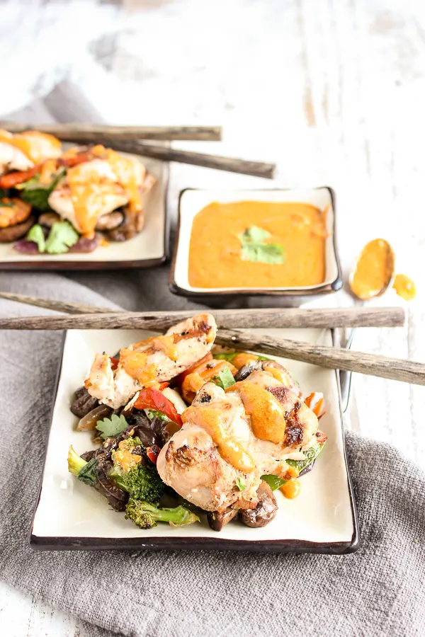 A simple marinade, along with some help from the grocery store make these chicken satay skewers with stir fried veggies a delicious and easy dinner option any night of the week.
