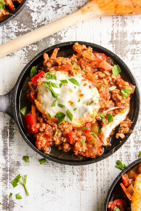 Italian stuffed pepper cauliflower rice skillet is a delicious twist on traditional stuffed peppers.  It's low carb, high protein and ready in 30 minutes, making it perfect for any night of the week.